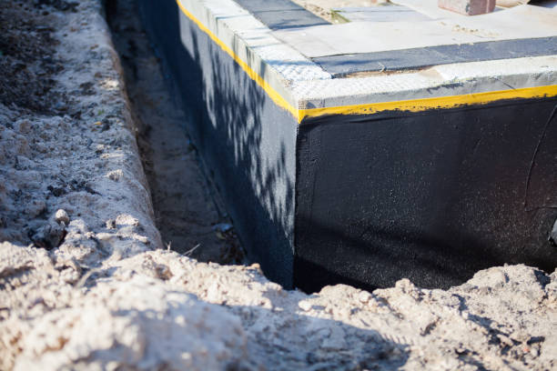 Professional Waterproofing technician working in Hebron, IN